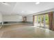 Spacious living room featuring recessed lighting and multiple windows and french doors to the outside at 605 Glen Eden Dr, Raleigh, NC 27612