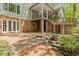 Beautiful patio with a peaceful water feature, steps to backyard, and access to covered porch at 605 Glen Eden Dr, Raleigh, NC 27612