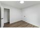 Bright bedroom featuring light walls, wood-look floors and a walk-in closet at 606 Cecil Street St, Durham, NC 27707