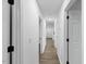 Long hallway enhanced by fresh paint, recessed lighting, and wood-look flooring at 606 Cecil Street St, Durham, NC 27707