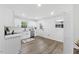 Modern kitchen with white cabinetry, stainless steel appliances, and stylish countertops at 606 Cecil Street St, Durham, NC 27707