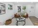 Bright living room features a comfortable leather sofa and stylish glass coffee table at 606 Cecil Street St, Durham, NC 27707