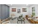 Well-lit living space with a plush leather couch and decor at 606 Cecil Street St, Durham, NC 27707