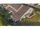 Aerial view of townhome featuring a screened porch, lawn, and manicured landscaping at 617 Sealine Dr, Cary, NC 27519