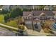 Aerial view of a charming two-story townhome with a two-car garage and well-maintained landscaping at 617 Sealine Dr, Cary, NC 27519