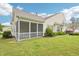 Backyard featuring a screened-in porch and a lush green lawn at 617 Sealine Dr, Cary, NC 27519