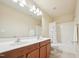 Bathroom featuring double sinks, tile floors, and a shower-tub combination at 617 Sealine Dr, Cary, NC 27519
