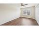 Bedroom featuring hardwood floors, a window, a ceiling fan, and a closet at 617 Sealine Dr, Cary, NC 27519