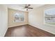 Bedroom featuring hardwood floors, a window, and a ceiling fan at 617 Sealine Dr, Cary, NC 27519