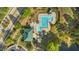 Birds eye view of a community pool, bathhouse, green space and playground at 617 Sealine Dr, Cary, NC 27519