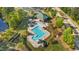 An aerial view of a community pool with bathhouse, playground and green space at 617 Sealine Dr, Cary, NC 27519