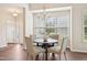 Charming dining area with a round table, chandelier lighting, and large window with natural light at 617 Sealine Dr, Cary, NC 27519