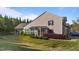 Lovely home exterior featuring mature landscaping and a screened porch at 617 Sealine Dr, Cary, NC 27519