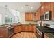 Well-equipped kitchen with granite countertops, stainless steel appliances, and ample wood cabinetry at 617 Sealine Dr, Cary, NC 27519