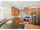 Spacious kitchen with granite countertops, stainless steel appliances, and plentiful cabinet space at 617 Sealine Dr, Cary, NC 27519