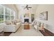 Cozy living room with vaulted ceilings, fireplace, ceiling fan and lots of light at 617 Sealine Dr, Cary, NC 27519