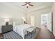Beautiful main bedroom with a ceiling fan, decorative lamps, and wood flooring at 617 Sealine Dr, Cary, NC 27519