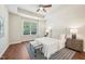 Serene main bedroom featuring a ceiling fan, accent rug, and neutral tones for a relaxing ambiance at 617 Sealine Dr, Cary, NC 27519
