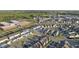 Breathtaking aerial view of a neighborhood with tree-lined streets, manicured lawns and community school at 6511 Academic Ave, Raleigh, NC 27616