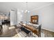 Cozy dining area with wooden table, chairs, bench, and natural light, perfect for Gathering meals and entertaining at 6511 Academic Ave, Raleigh, NC 27616