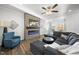 Living room boasts a fireplace and open view to the kitchen at 6511 Academic Ave, Raleigh, NC 27616