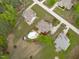 Aerial view showcasing the layout of multiple homes in a community, highlighting green spaces and backyard pool at 6512 Southern Times Dr, Raleigh, NC 27603