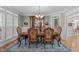 Traditional dining room featuring elegant furnishings, wainscoting, and ample natural light at 6512 Southern Times Dr, Raleigh, NC 27603