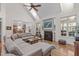 Bright living room features high ceilings, a fireplace, and views into other parts of the home at 6512 Southern Times Dr, Raleigh, NC 27603