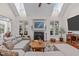 Cozy living room with fireplace and hardwood floors provides an inviting space to relax and unwind at 6512 Southern Times Dr, Raleigh, NC 27603