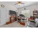 Cozy office with natural light, a full bookcase, and comfortable furnishings at 6512 Southern Times Dr, Raleigh, NC 27603