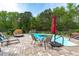 Backyard pool with brick pavers and an umbrella table offers a great spot for outdoor relaxation at 6512 Southern Times Dr, Raleigh, NC 27603