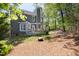 Spacious backyard with deck featuring outdoor seating and BBQ with wooded views at 7 Wythebrook Ln, Durham, NC 27713