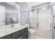 Bathroom featuring vanity, toilet, and shower-tub combo with sliding glass door at 7 Wythebrook Ln, Durham, NC 27713