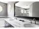 Bathroom featuring double vanity, soaking tub, walk-in shower, and octagon windows at 7 Wythebrook Ln, Durham, NC 27713