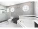 Bright bathroom featuring a walk-in shower, soaking tub, and octagon windows at 7 Wythebrook Ln, Durham, NC 27713