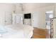 Spacious bedroom with ceiling fan, and ensuite bathroom access at 7 Wythebrook Ln, Durham, NC 27713