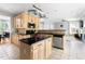 Bright, open kitchen with stainless steel appliances, an island, and granite countertops at 7 Wythebrook Ln, Durham, NC 27713