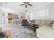 Open-concept living room connects to the kitchen with comfortable seating and a view of the fireplace at 7 Wythebrook Ln, Durham, NC 27713