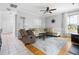 Cozy living room with neutral tones, ceiling fan, and plush seating at 7 Wythebrook Ln, Durham, NC 27713