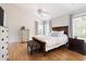 Bright main bedroom with vaulted ceilings and hardwood floors at 7 Wythebrook Ln, Durham, NC 27713