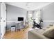 Office with desk, exercise bike, and hardwood flooring at 7 Wythebrook Ln, Durham, NC 27713