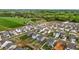 Aerial view showcasing the neighborhood, streets and the surrounding greenery at 7205 Tillage Rd, Mebane, NC 27302