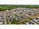 Aerial view of neighborhood homes surrounded by lush green trees and landscaping at 7205 Tillage Rd, Mebane, NC 27302