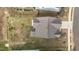 Aerial view of the house highlighting the roof and surrounding yard at 7205 Tillage Rd, Mebane, NC 27302