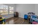 A bright room with ample storage, featuring hardwood floors and natural light at 7205 Tillage Rd, Mebane, NC 27302