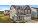 Beautiful two-story home with attached garage, covered porch, and professionally landscaped yard at 7205 Tillage Rd, Mebane, NC 27302