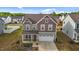 Well-manicured home boasting a lush lawn and inviting curb appeal at 7205 Tillage Rd, Mebane, NC 27302