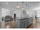 Expansive kitchen island, an open concept design, and views of the living room at 7205 Tillage Rd, Mebane, NC 27302