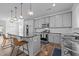 Spacious kitchen with modern appliances and a stylish island with barstool seating at 7205 Tillage Rd, Mebane, NC 27302