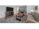 Open-concept living room view with a seamless flow to the kitchen, perfect for entertaining at 7205 Tillage Rd, Mebane, NC 27302